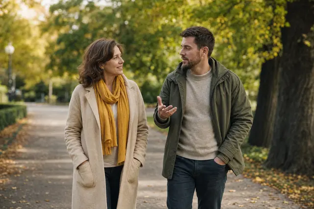 Life coach: a coach and a client on a walk-and-talk session along a tree-lined park path