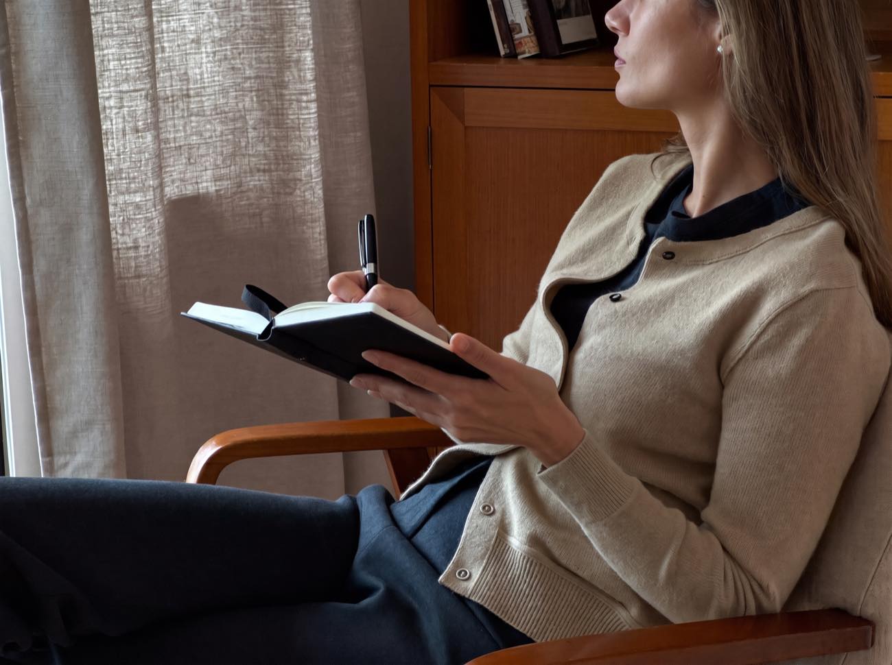 A therapist taking notes during a session